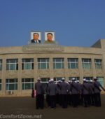 North Korea Pyongyang Kim il-Sung and Kim Jong-il portrait workers marching